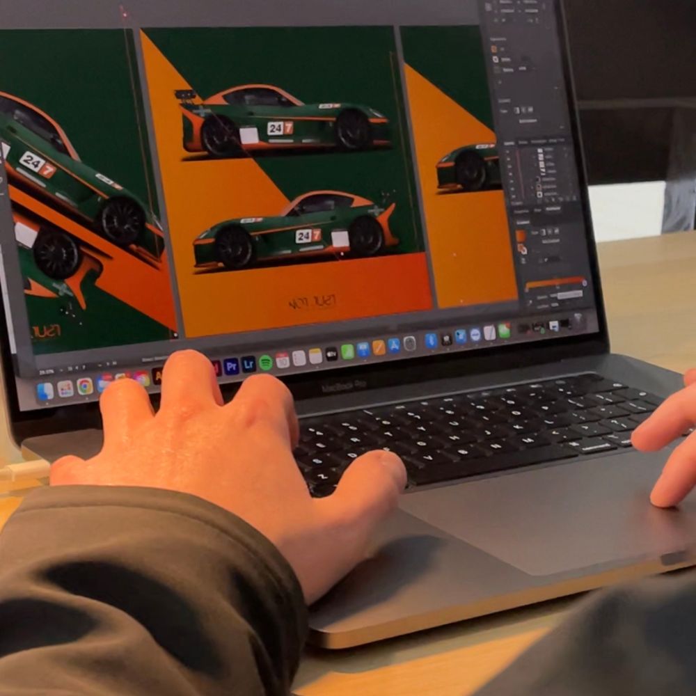 Encirco designer working on a motorsport vehicle wrap design in Adobe Illustrator